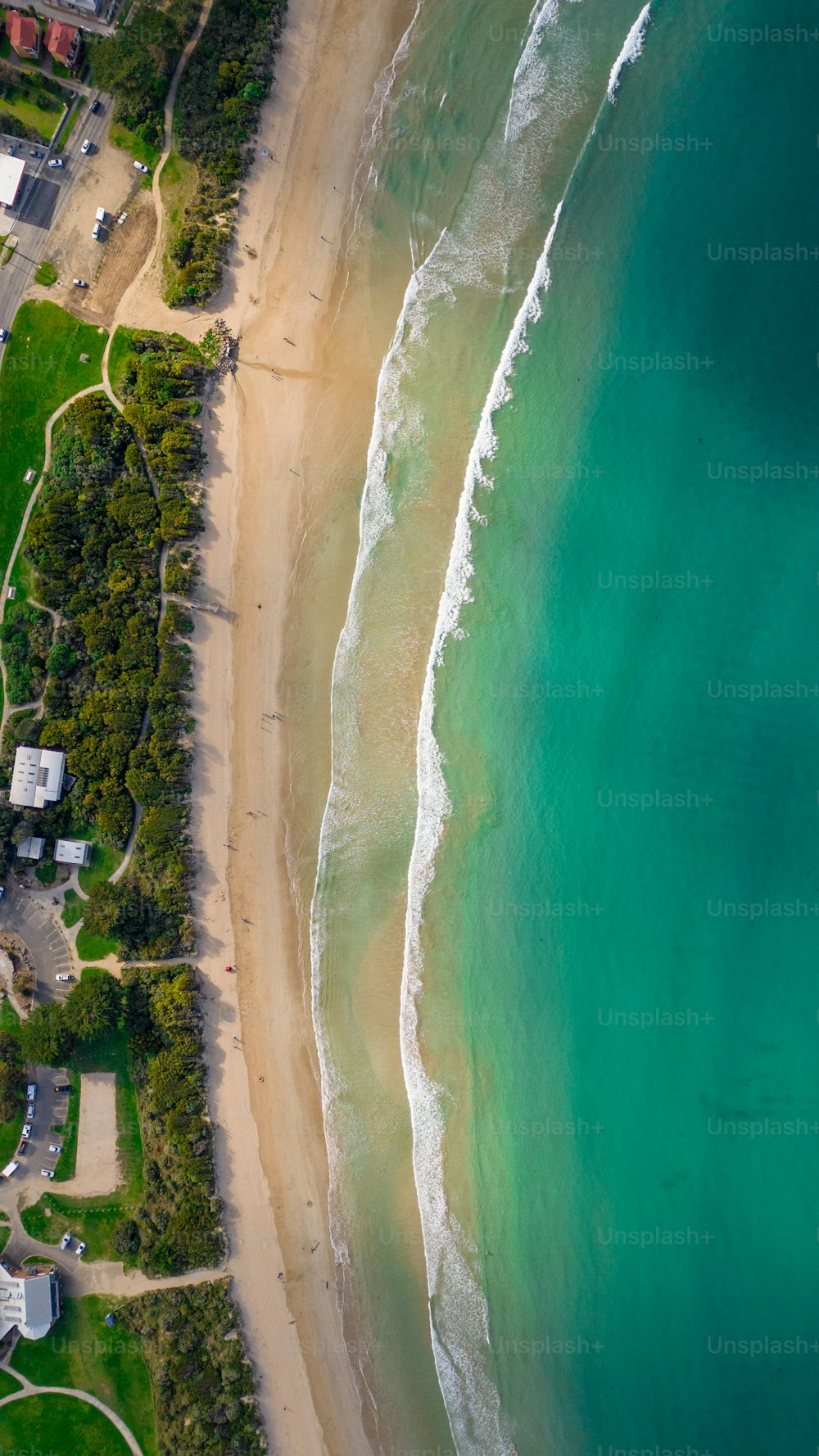 a bird's eye view of a beach and ocean