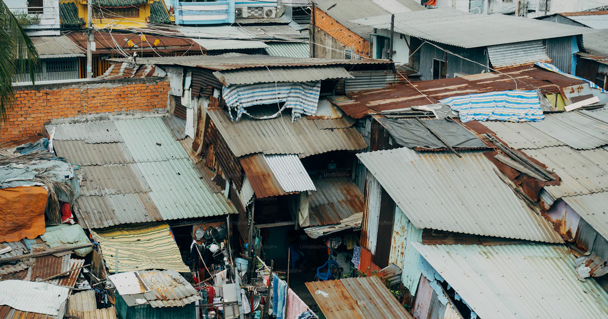 Stacks Slums A group of shacks that are next to each other photo – Slum Image on ...