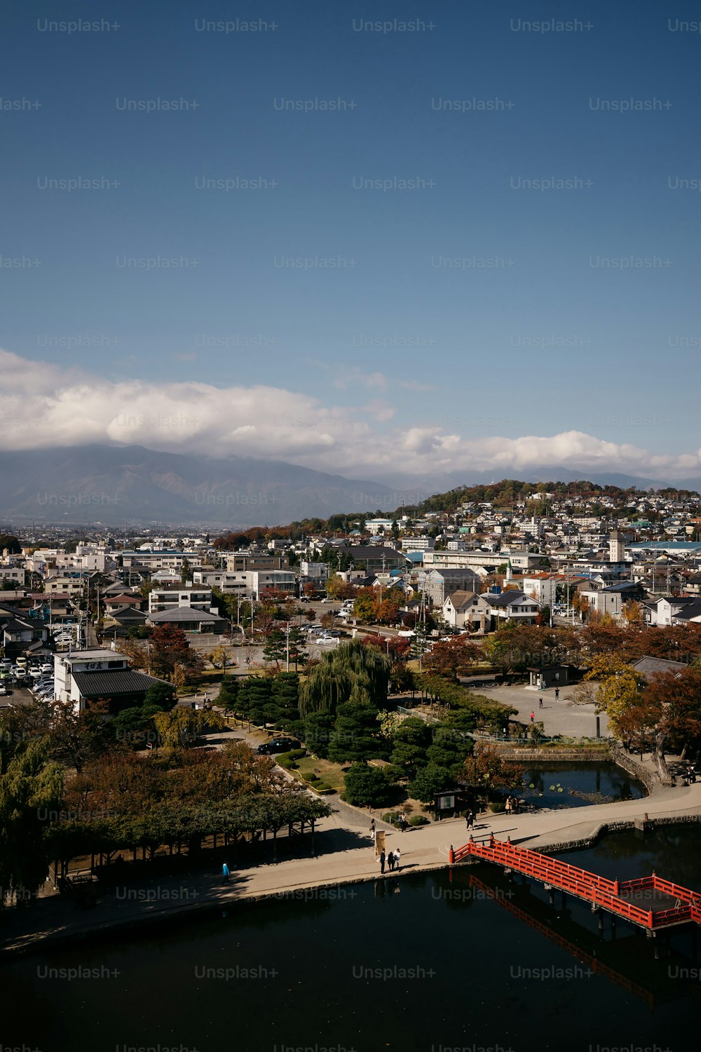 a large body of water with a city in the background