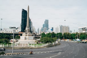 a view of a city with a large monument in the middle of the road