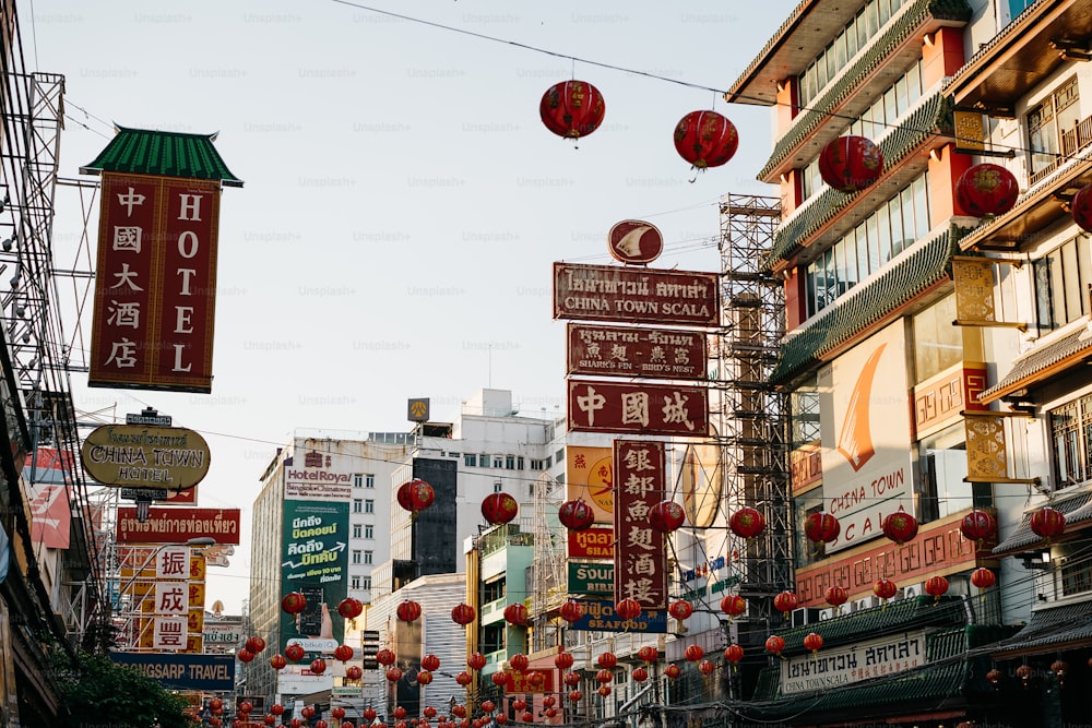 a city street filled with lots of red lanterns