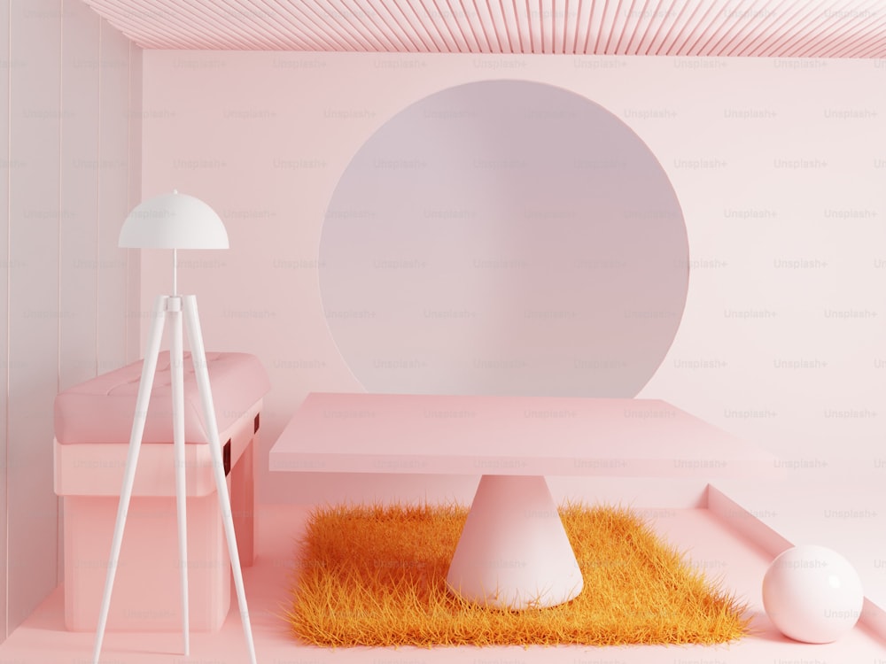 a pink room with a round mirror and a table