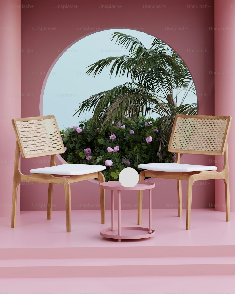 a pink room with two chairs and a table