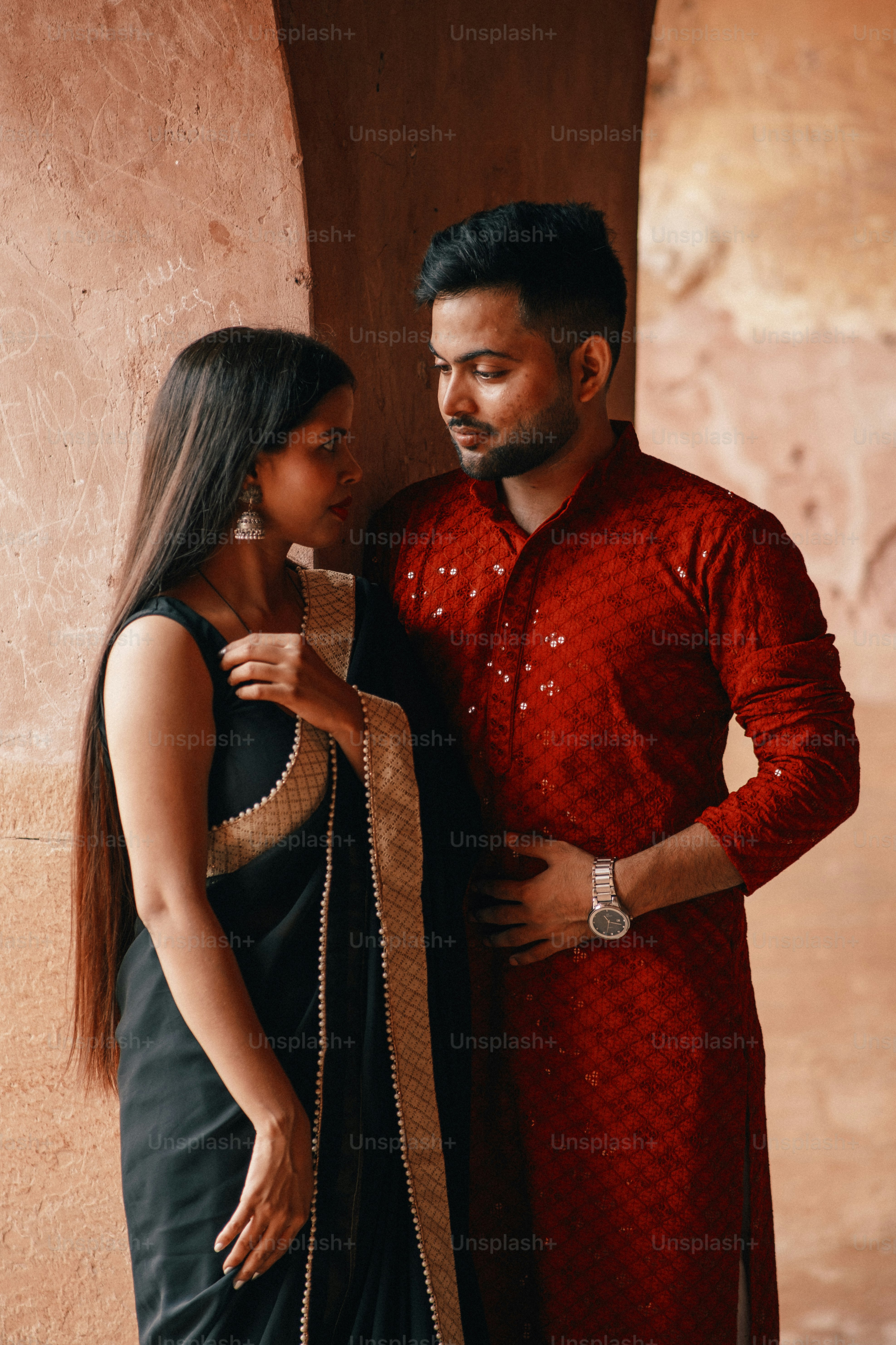 a man and a woman standing next to each other