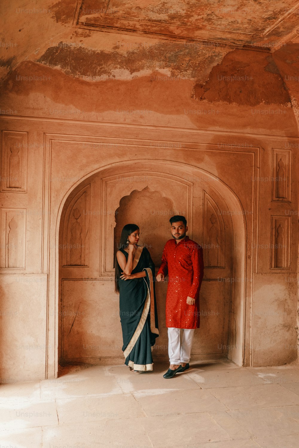 a man and a woman standing next to each other