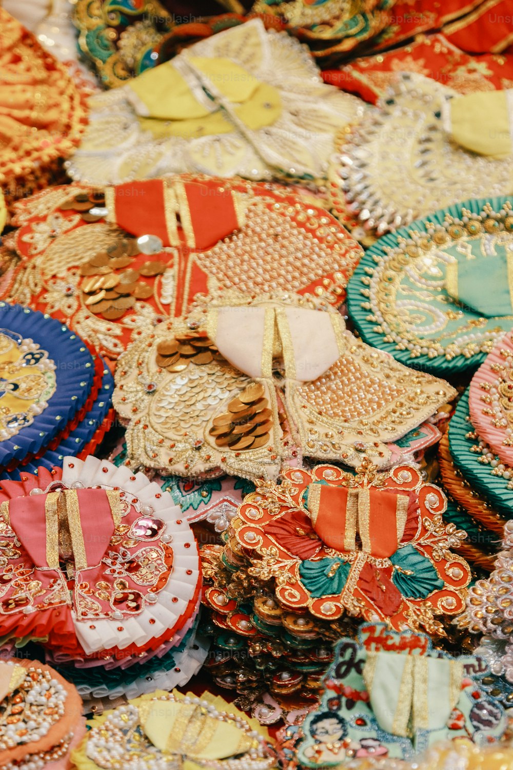 a table topped with lots of different colored plates