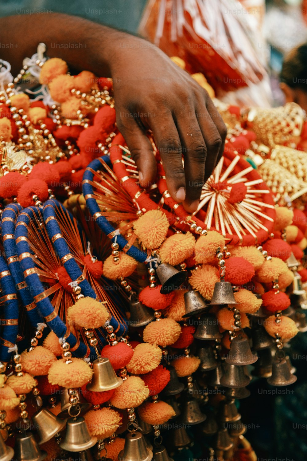a person holding a bunch of bells in their hands