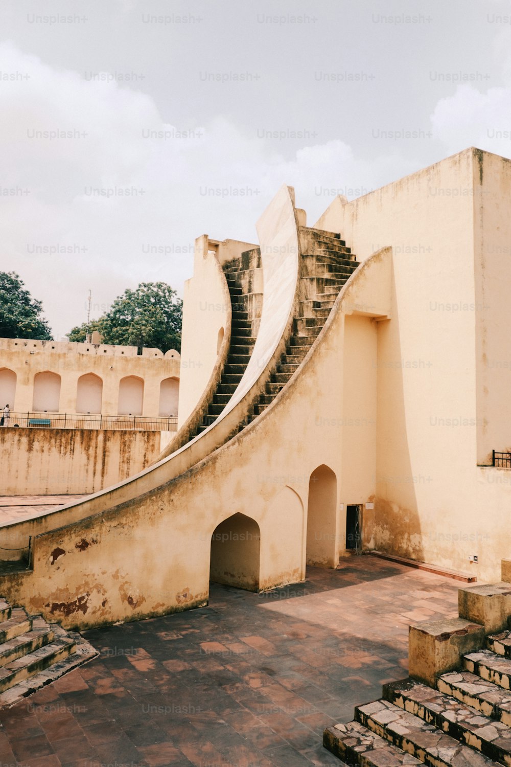 a very old building with some stairs going up it