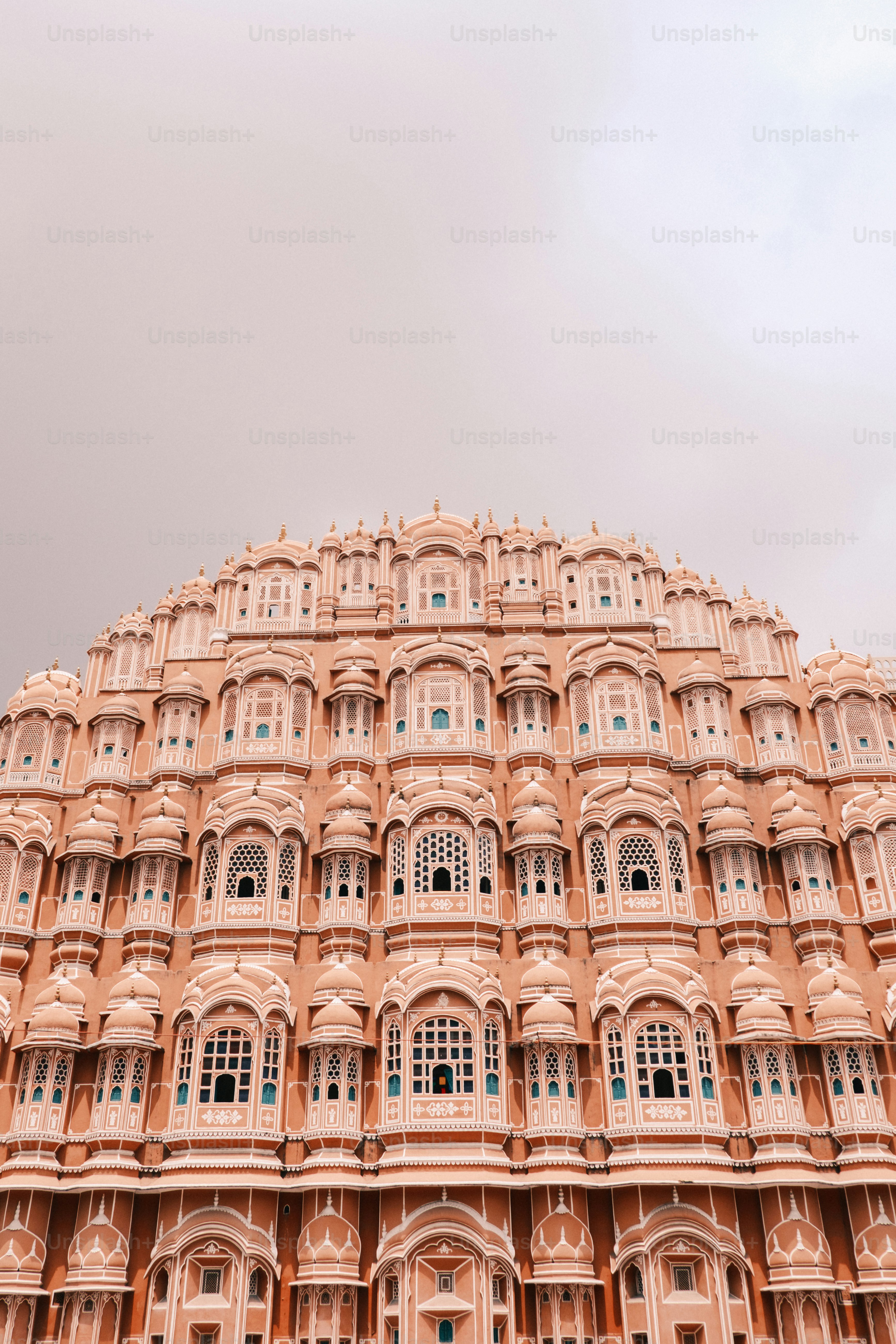 a very tall building with many windows and balconies