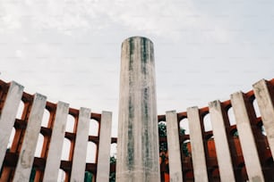 a tall pillar in the middle of a concrete structure