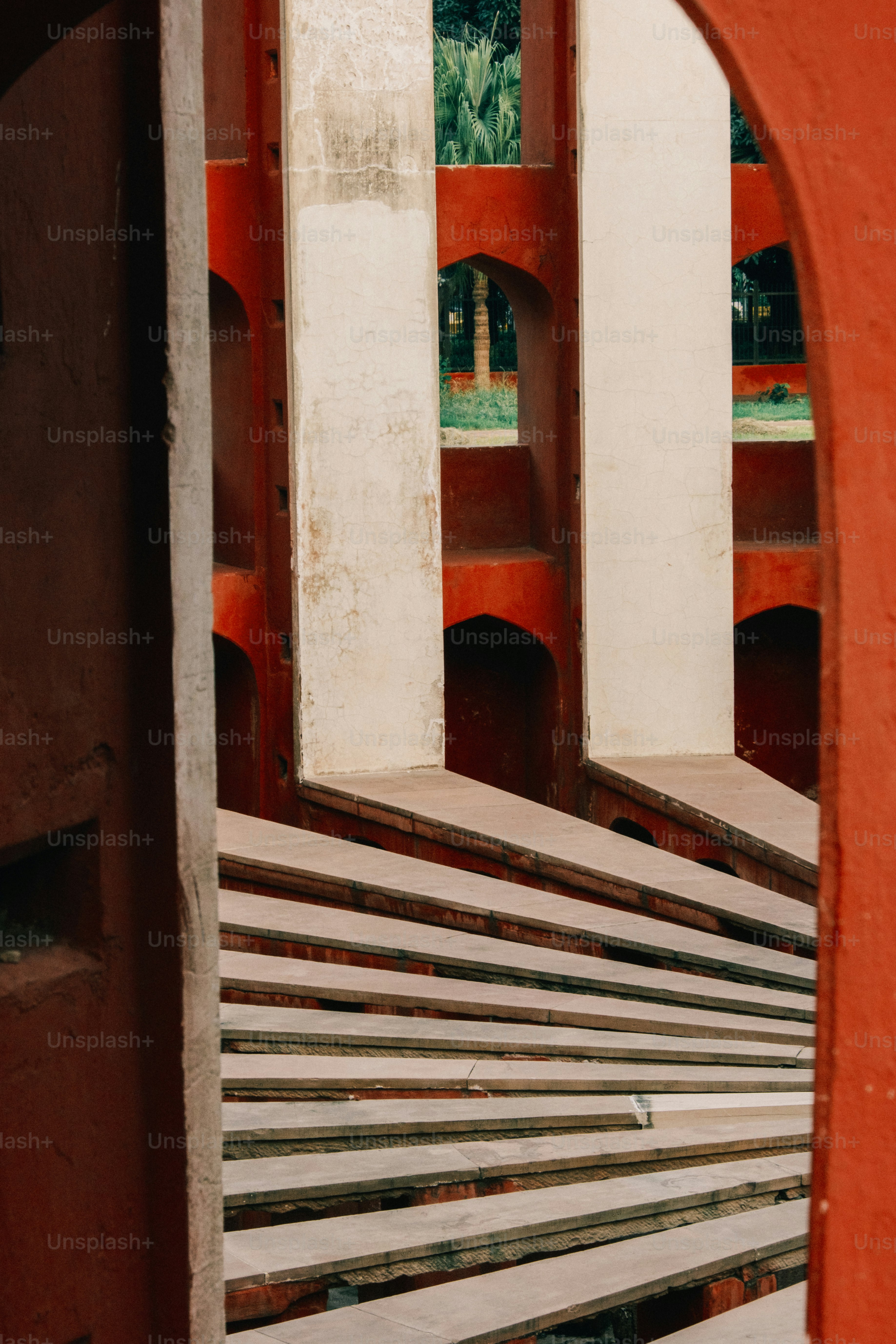 a red building with a bunch of benches in front of it
