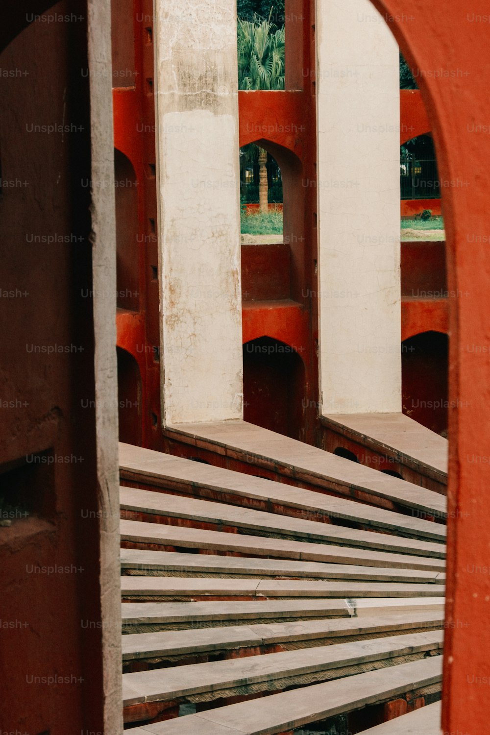 a red building with a bunch of benches in front of it