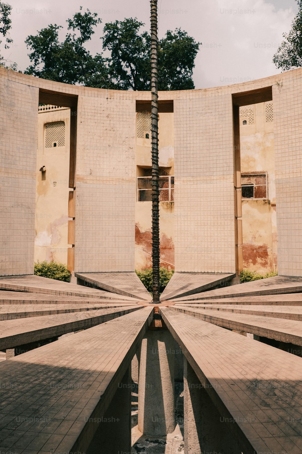 a very tall building with some steps in front of it