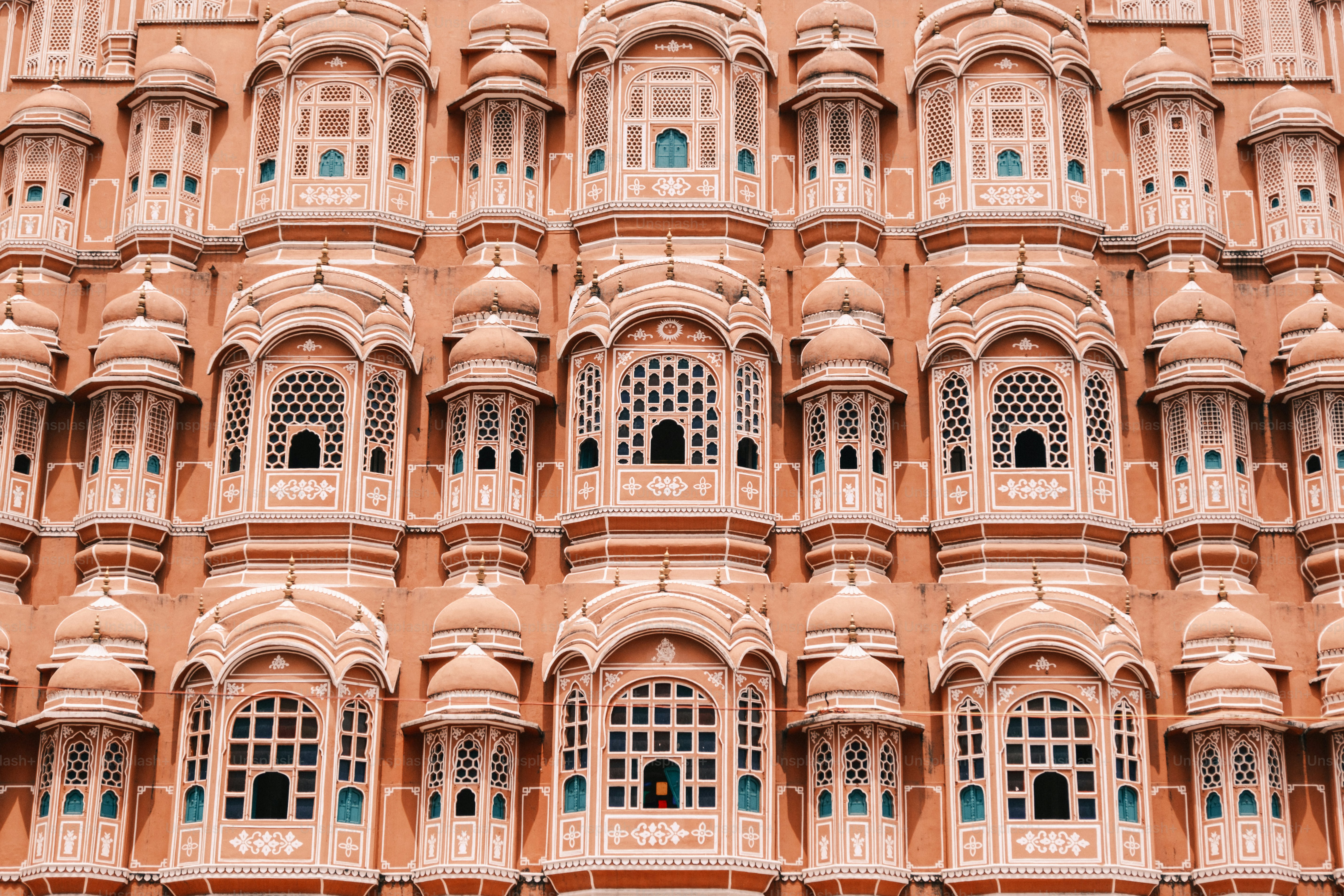 a very tall building with many windows and balconies