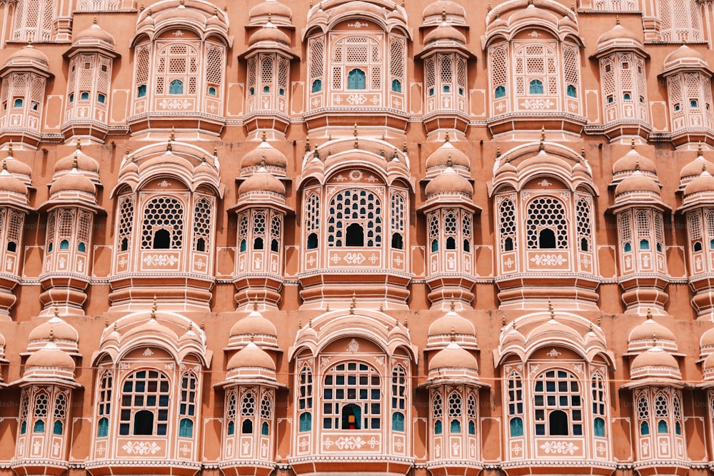 a very tall building with many windows and balconies