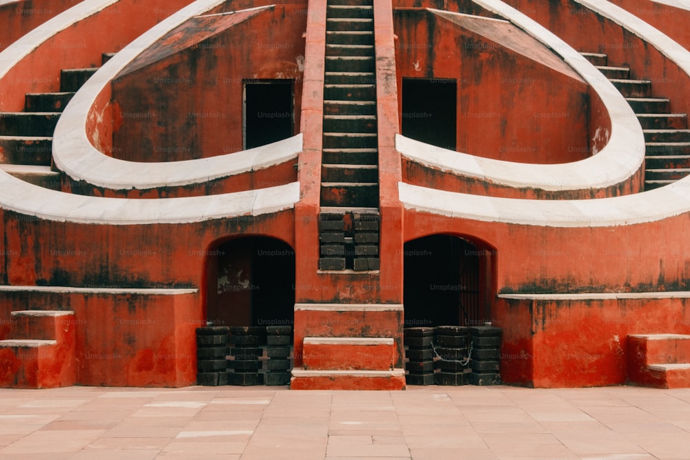 a red building with a spiral design on it