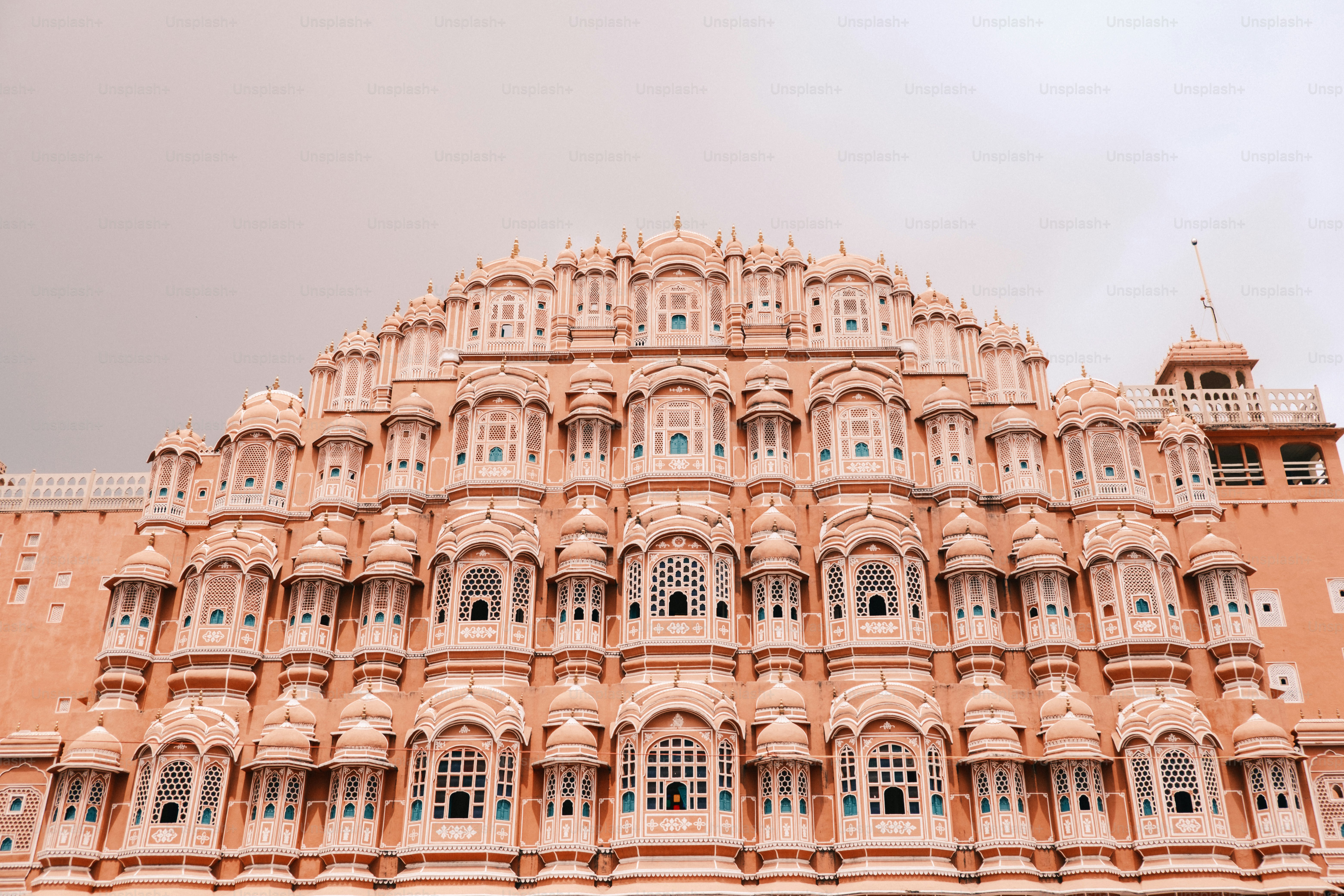 a very tall building with many windows and balconies