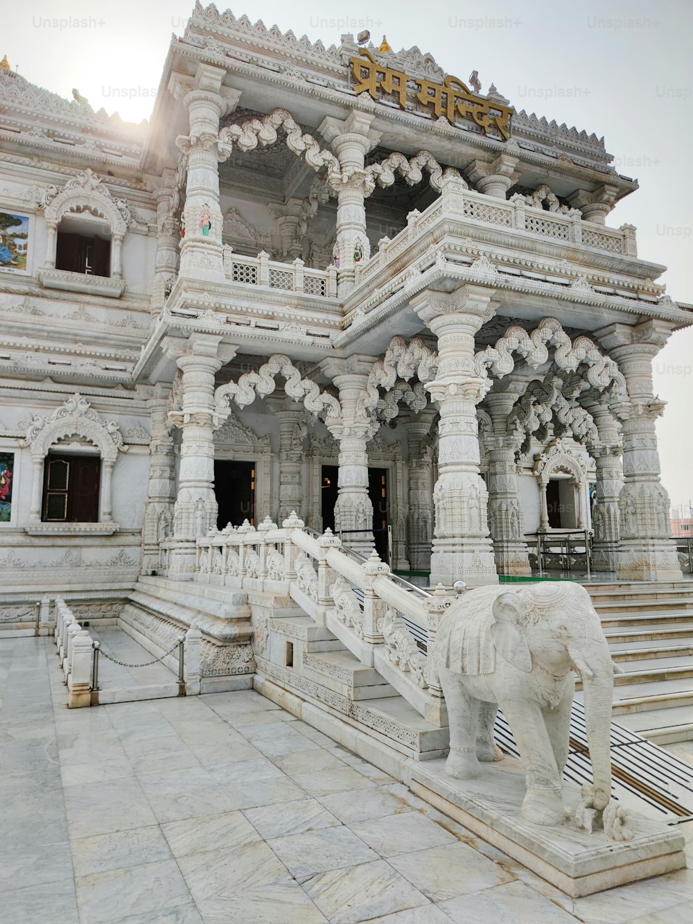 a white elephant statue in front of a building