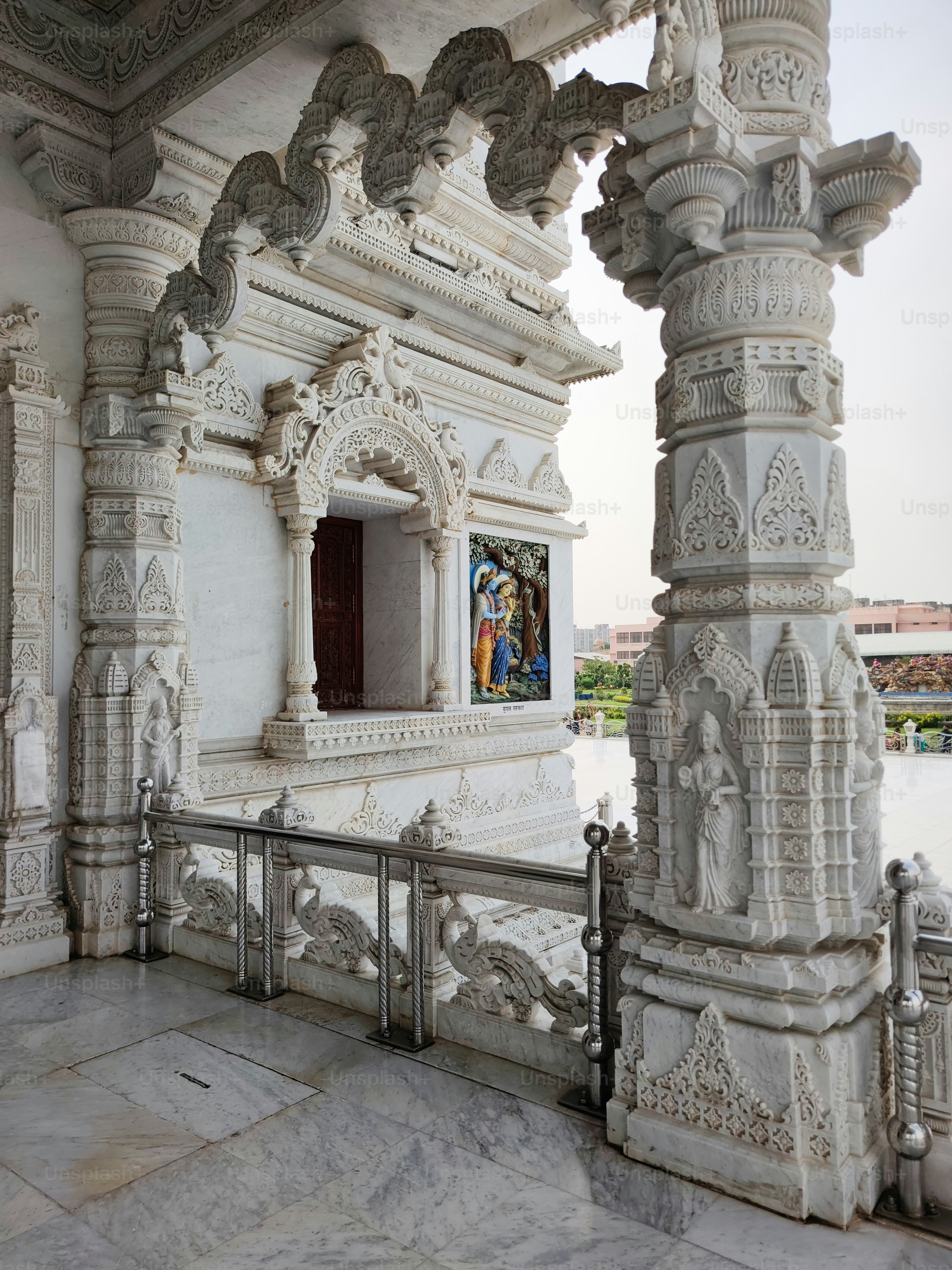 a white building with a painting on the wall