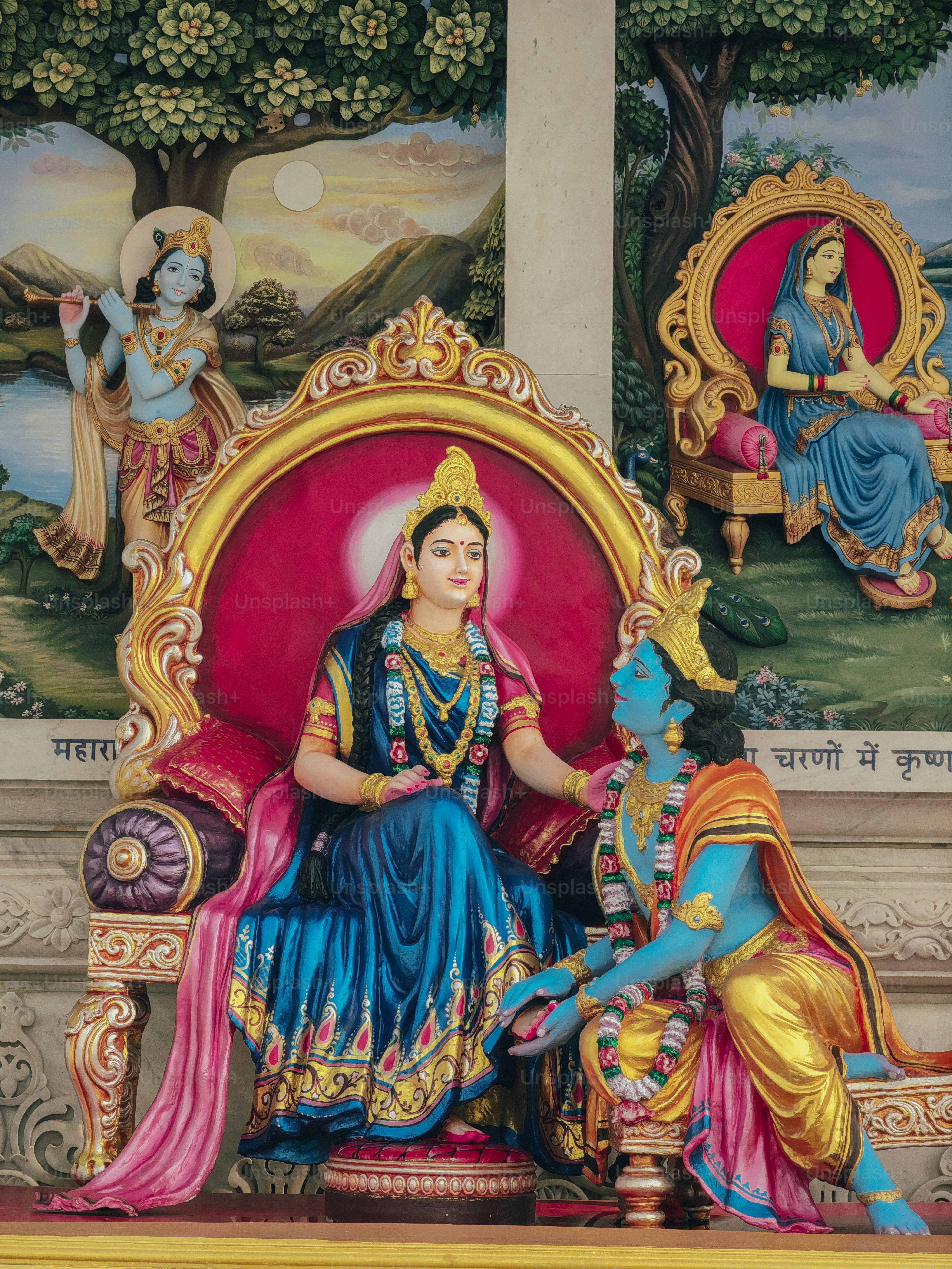 a statue of a woman sitting on a throne