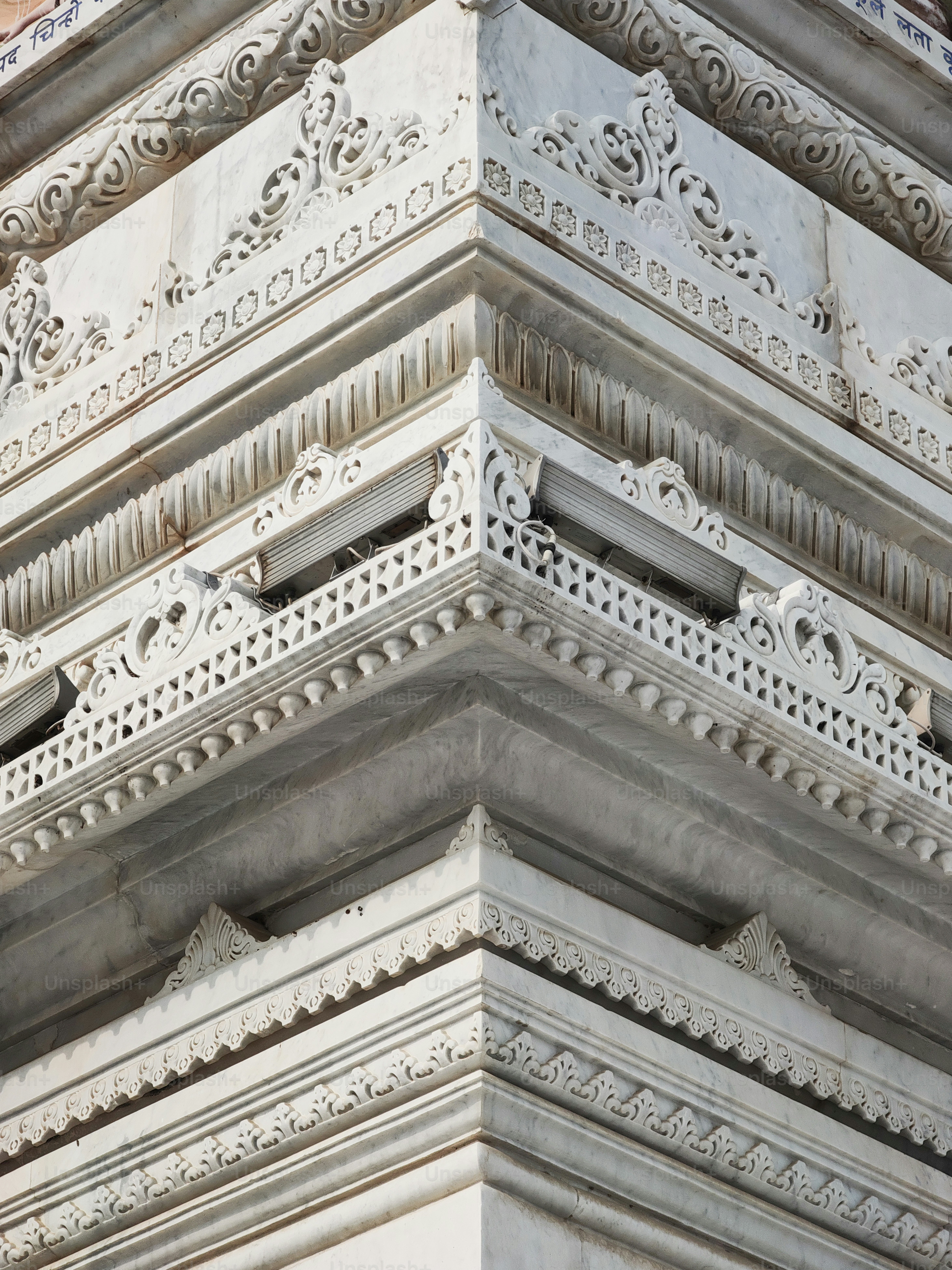 a close up of a clock on the side of a building