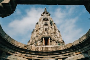 a very tall tower with a sky in the background