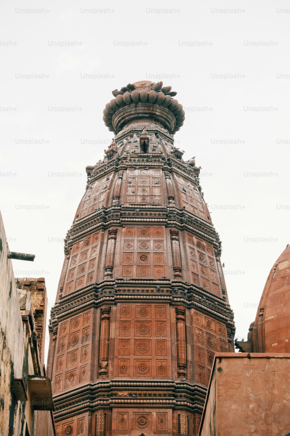 a tall tower with a clock on the top of it