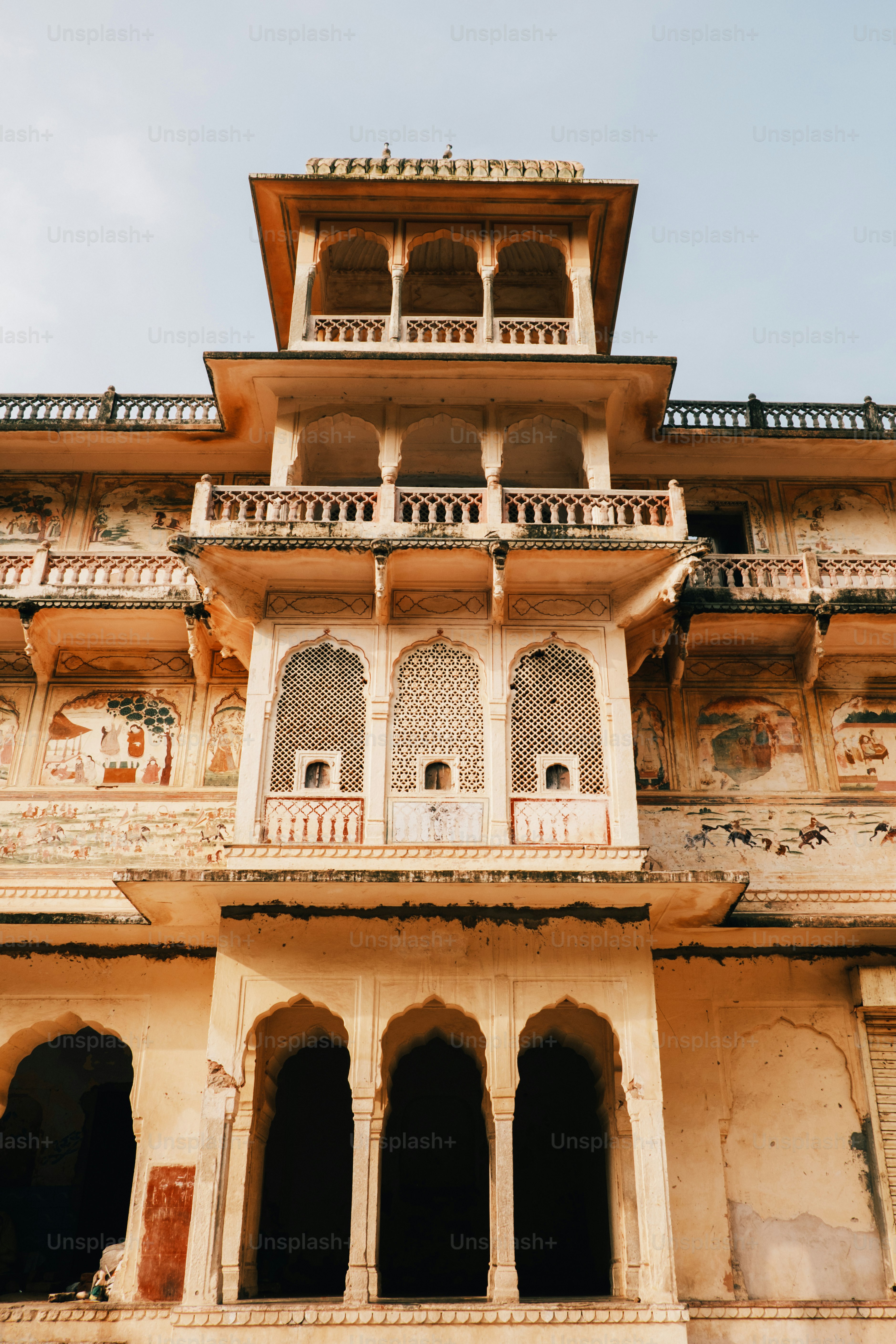a tall building with lots of windows and balconies