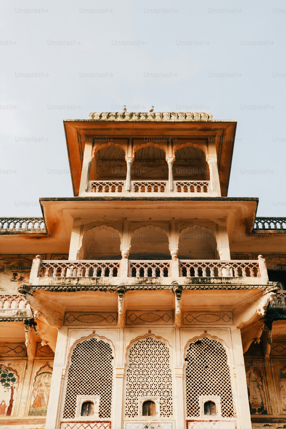 a tall building with many windows and balconies