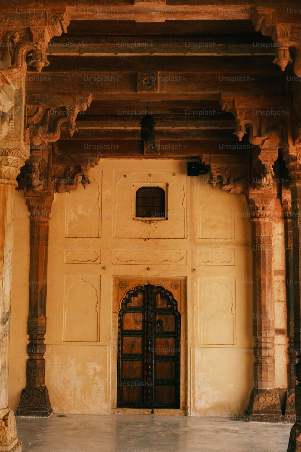 a large doorway with a clock on the wall