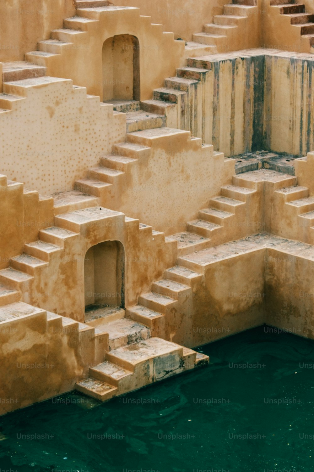 a group of steps sitting next to a body of water