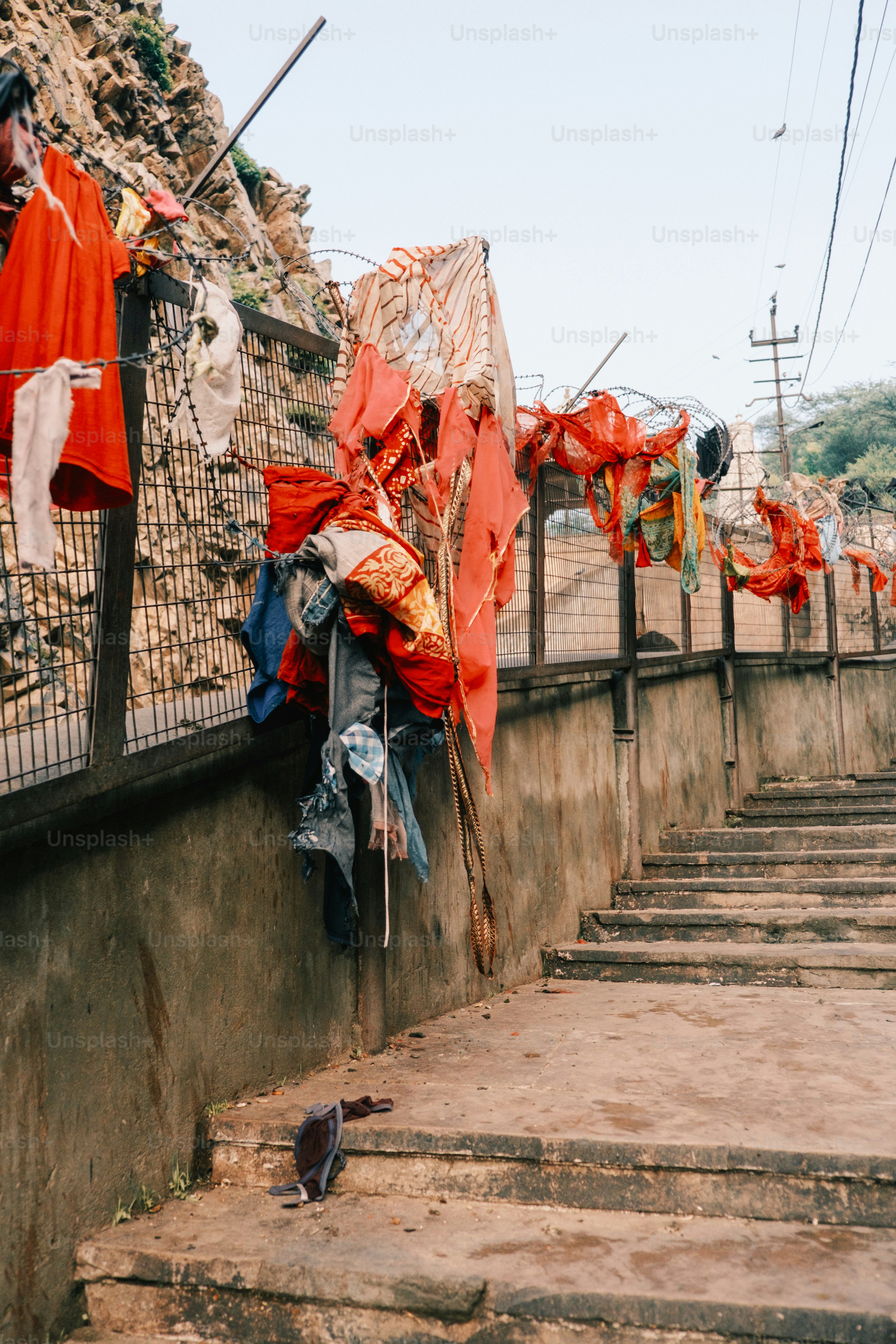 a bunch of clothes that are on a wall