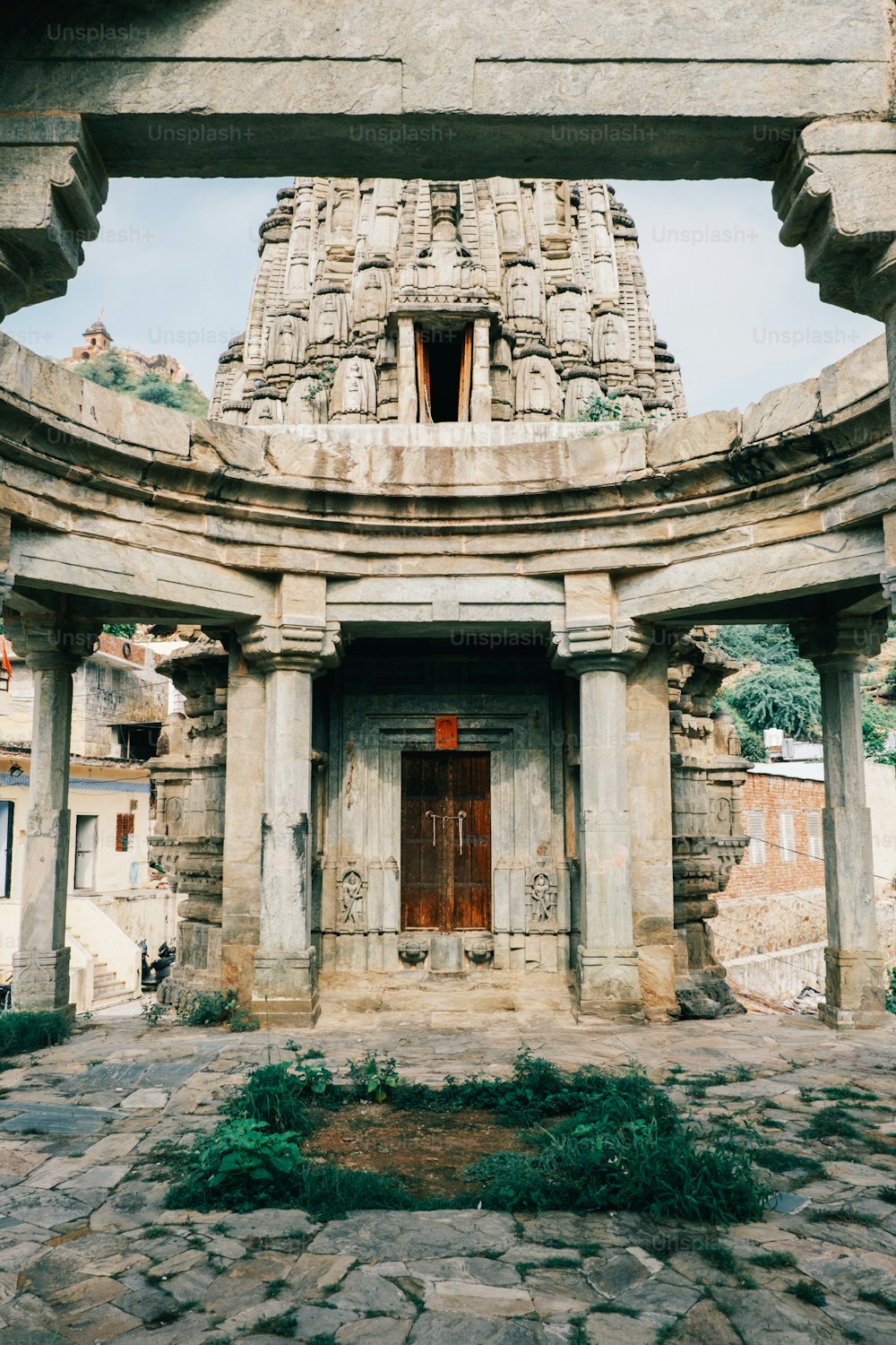 a stone building with a doorway and a doorway in the middle