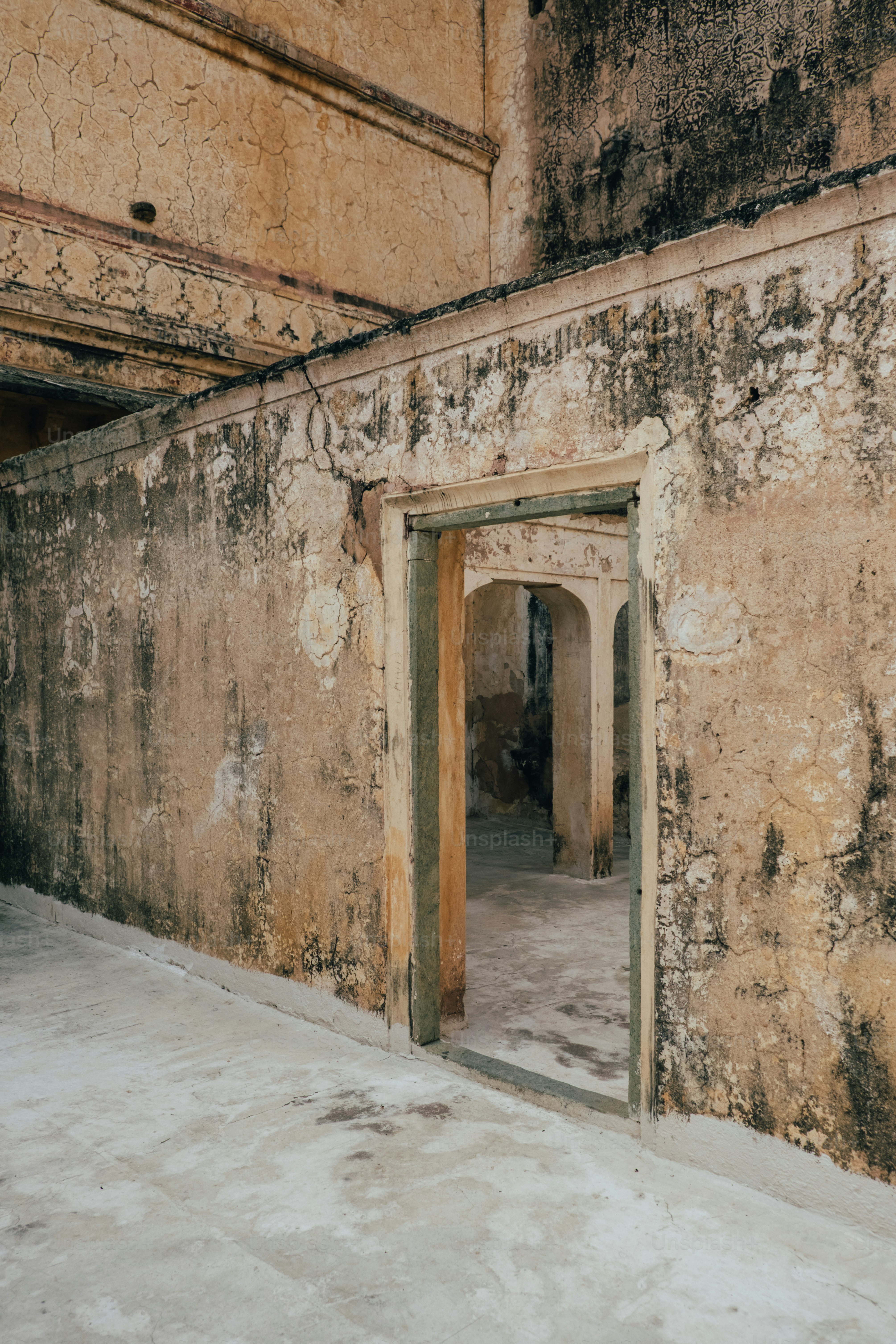 an old building with a door that is open