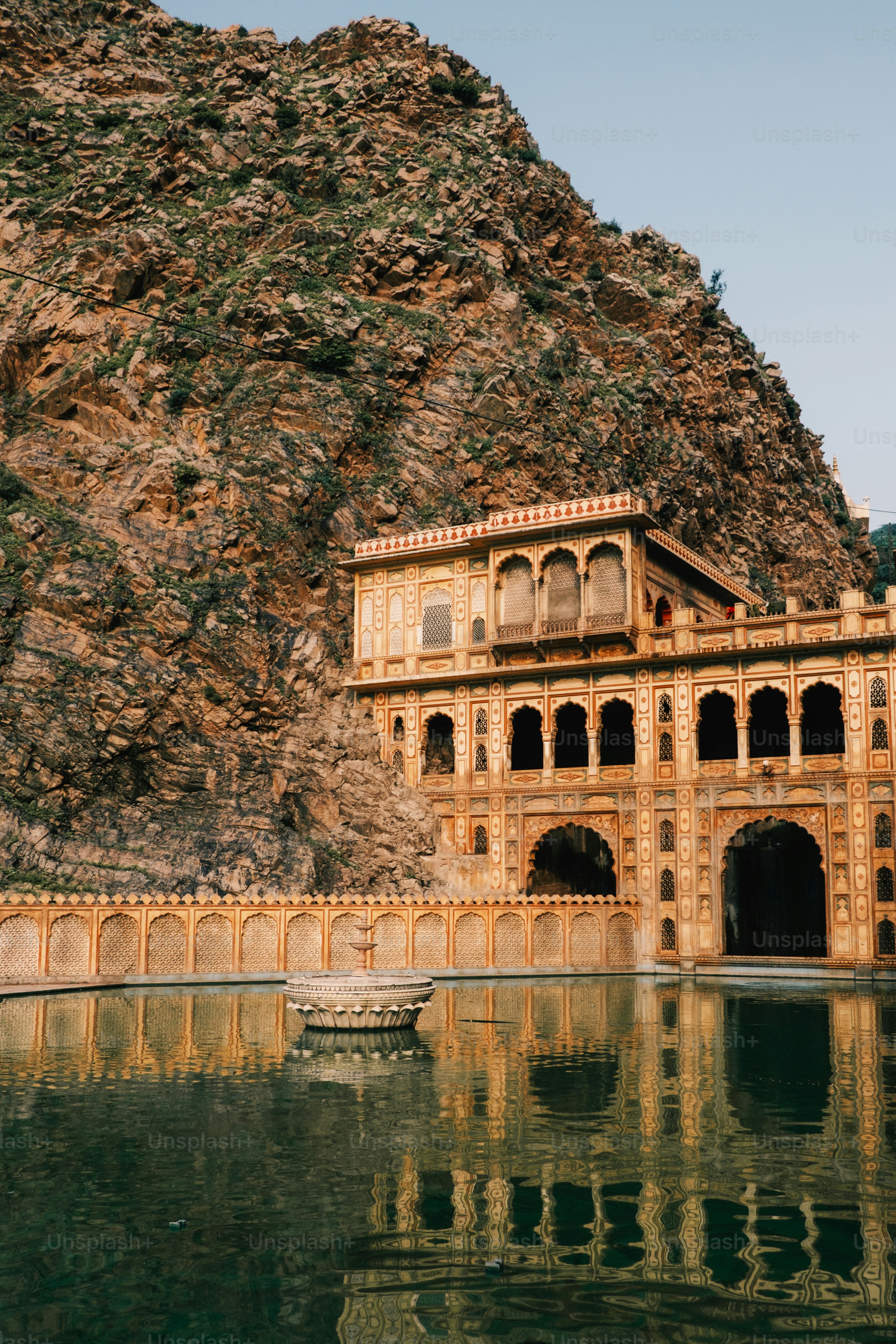 a large building sitting on top of a body of water