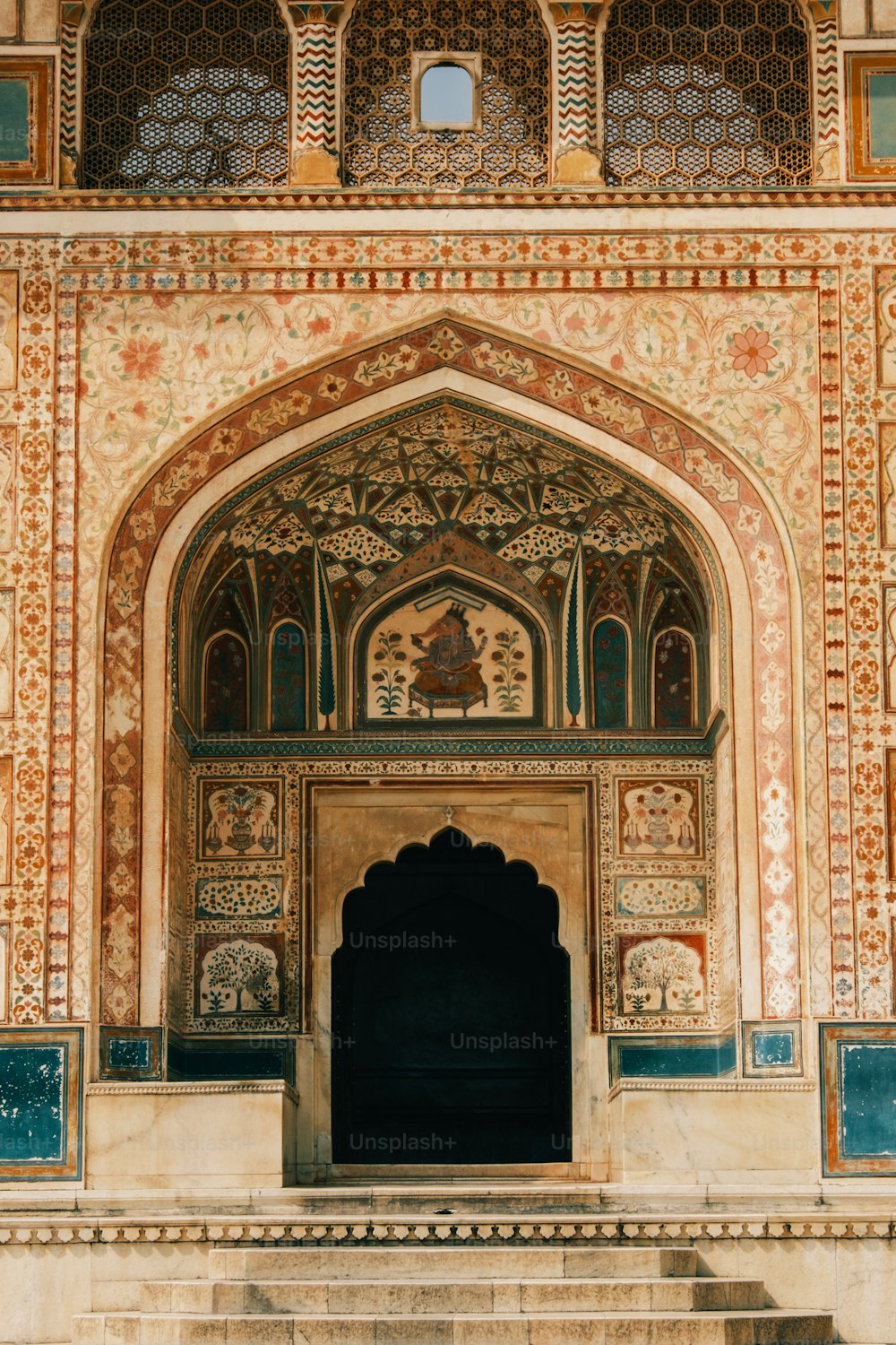 a large building with a doorway and steps leading up to it