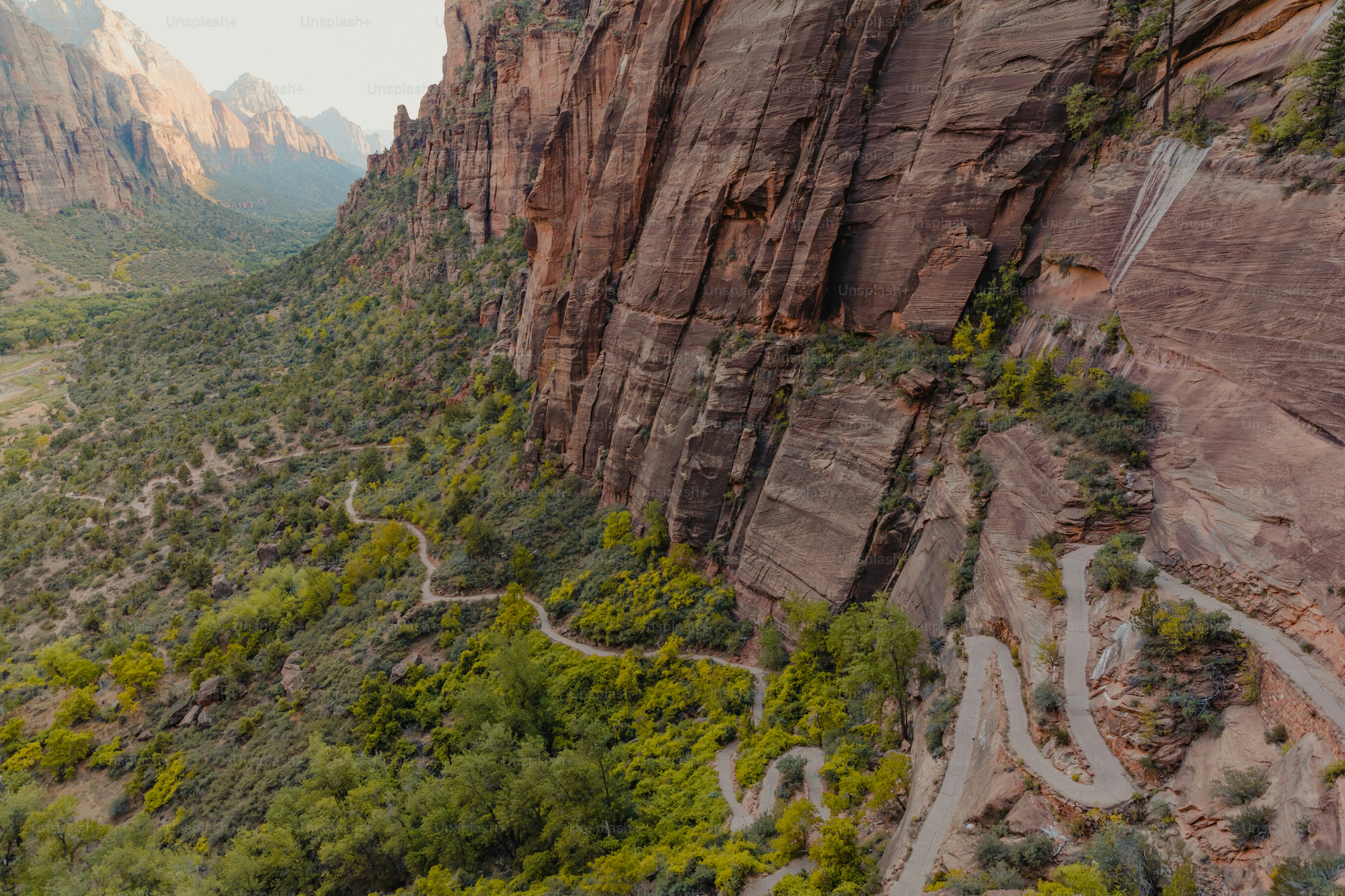 a scenic view of a mountain with a winding road