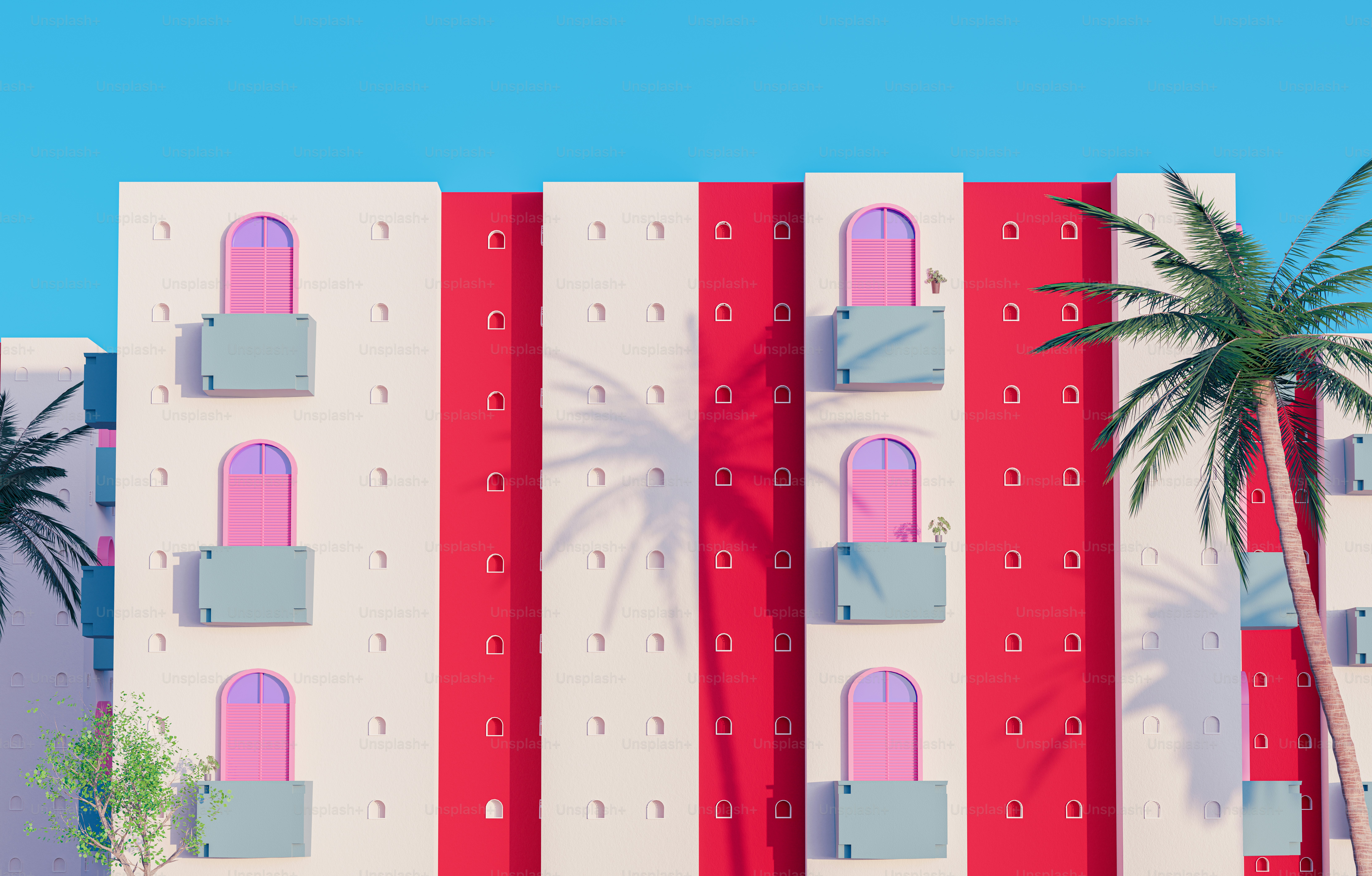 un palmier devant un grand immeuble