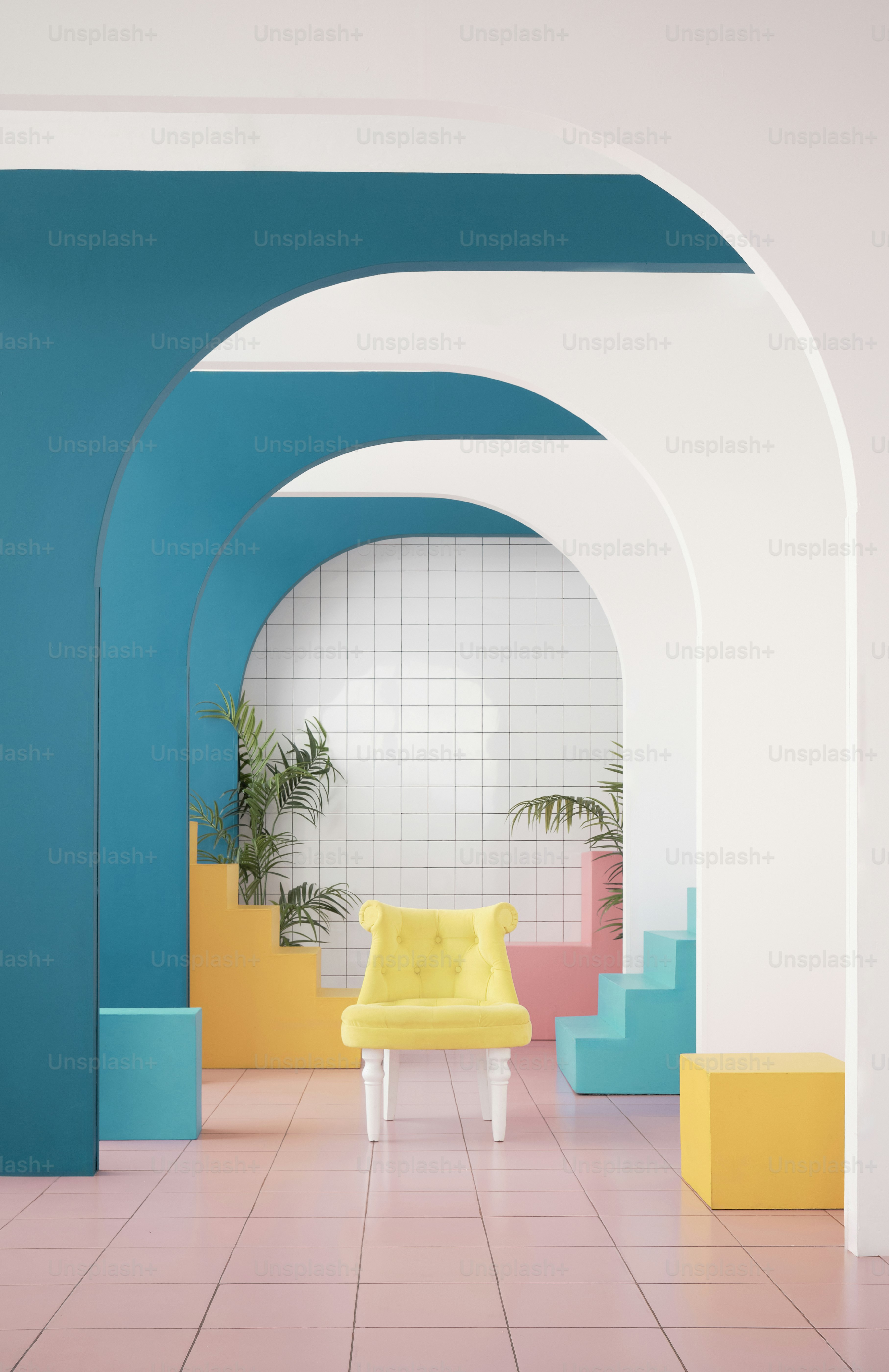 A yellow chair in a room with blue and yellow walls photo – Blue Image ...