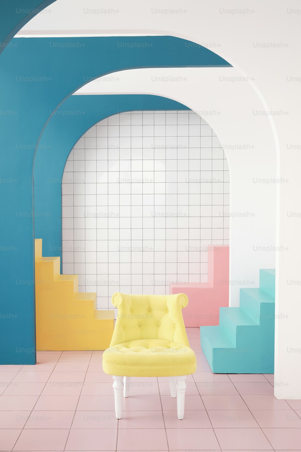 a yellow chair sitting in a room with blue and yellow walls