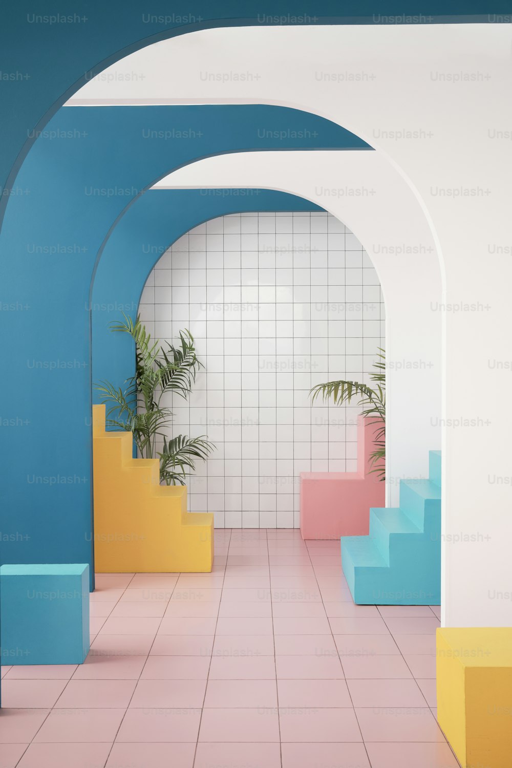 a room with blue, yellow, and pink walls