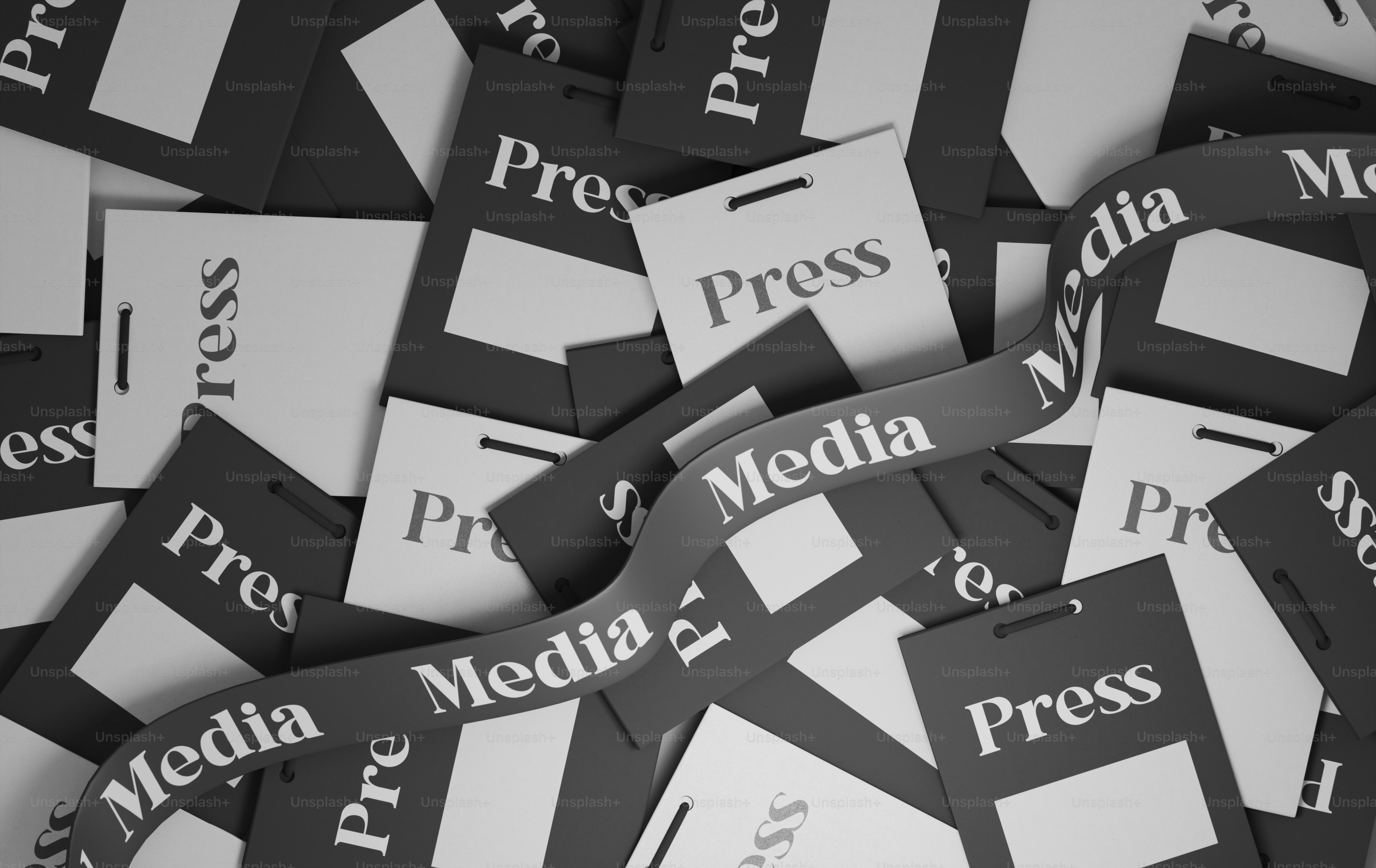 a pile of black and white papers with the word press on them