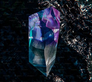 a crystal object is shown on a black surface
