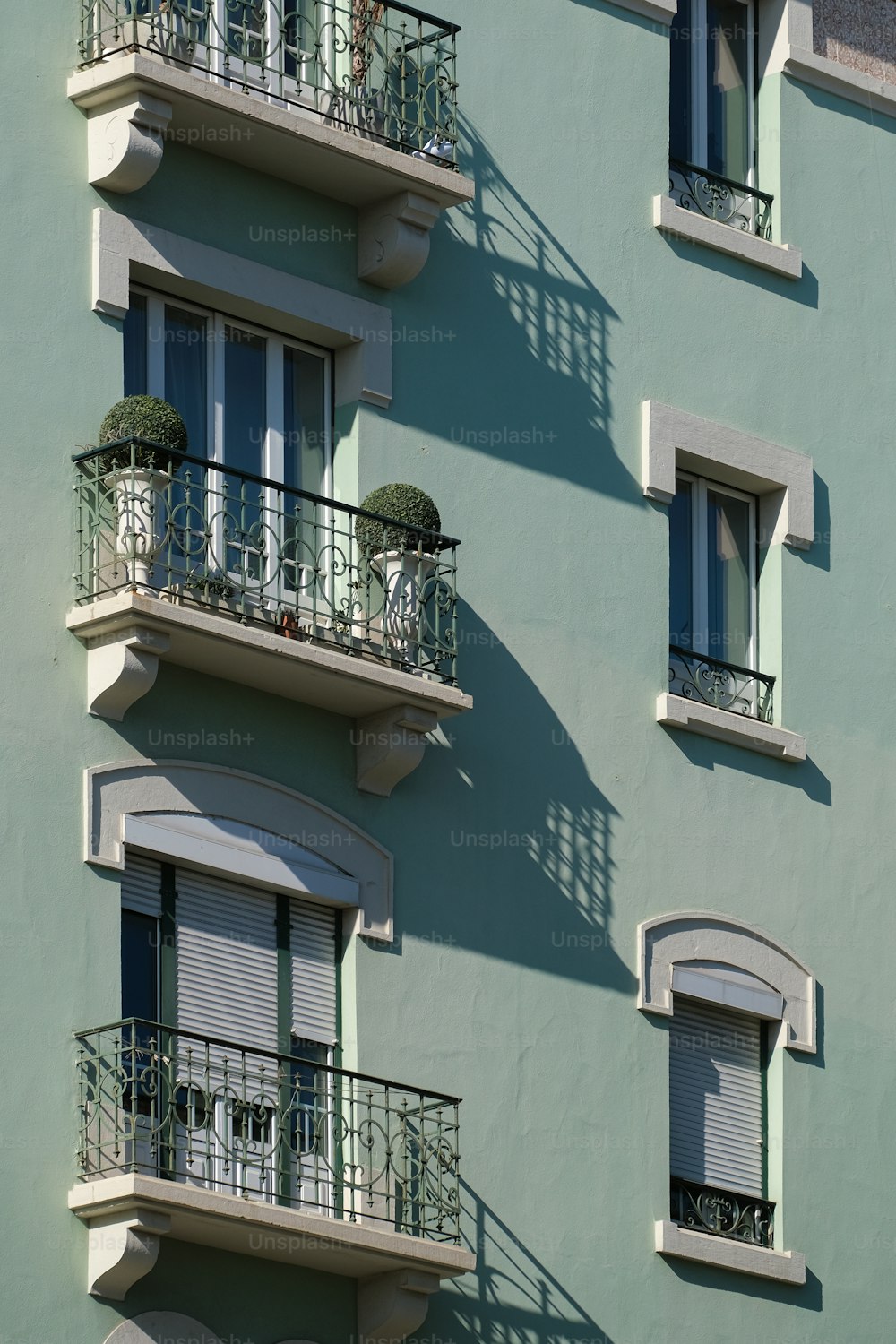 a tall building with balconies and balconies on the balconies