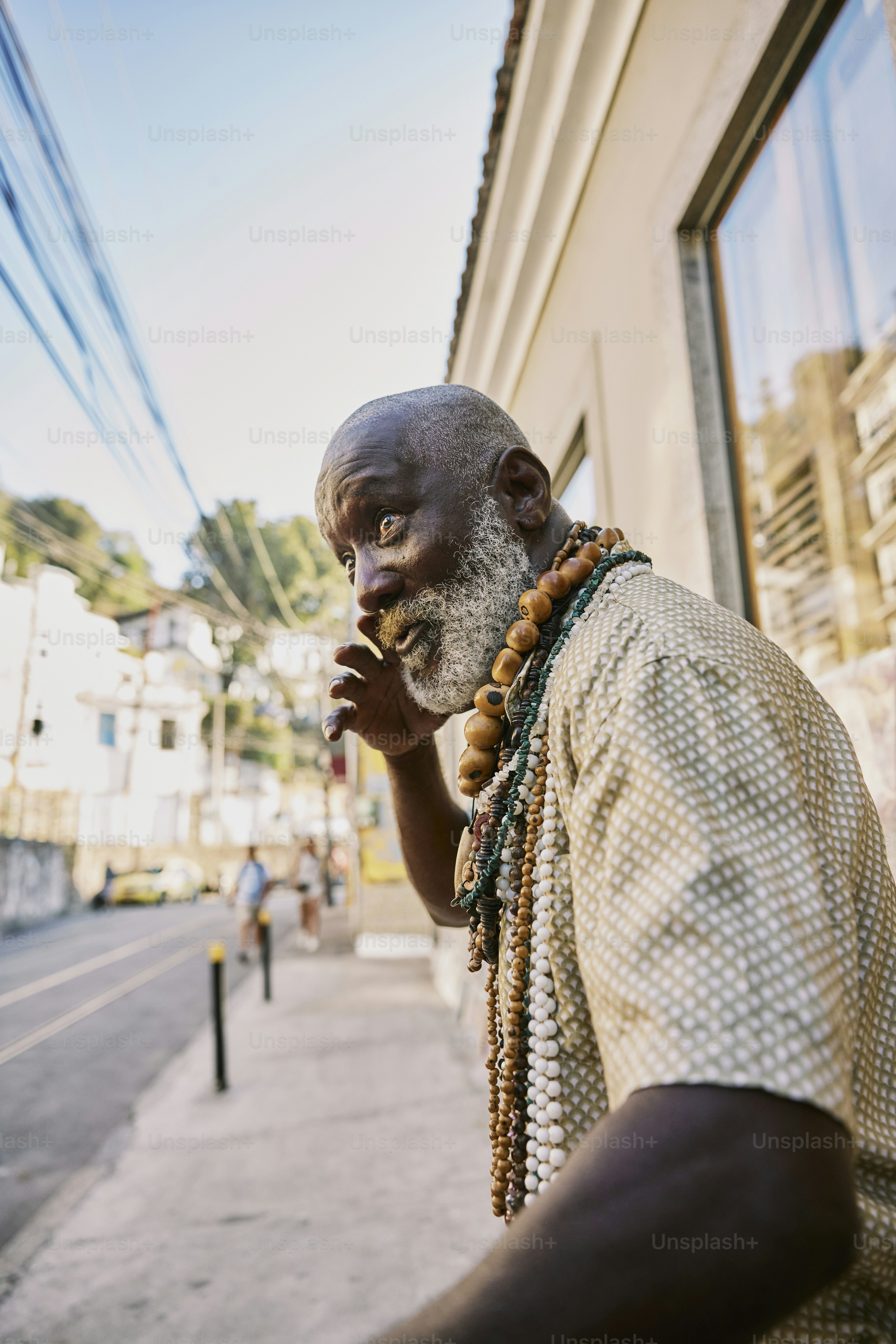 a man with a white beard and a white beard is standing in front of a