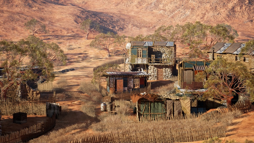 a group of buildings sitting on top of a dry grass field