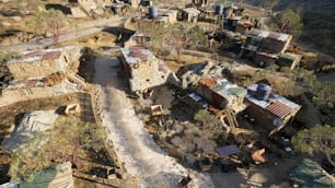 an aerial view of a village in the mountains