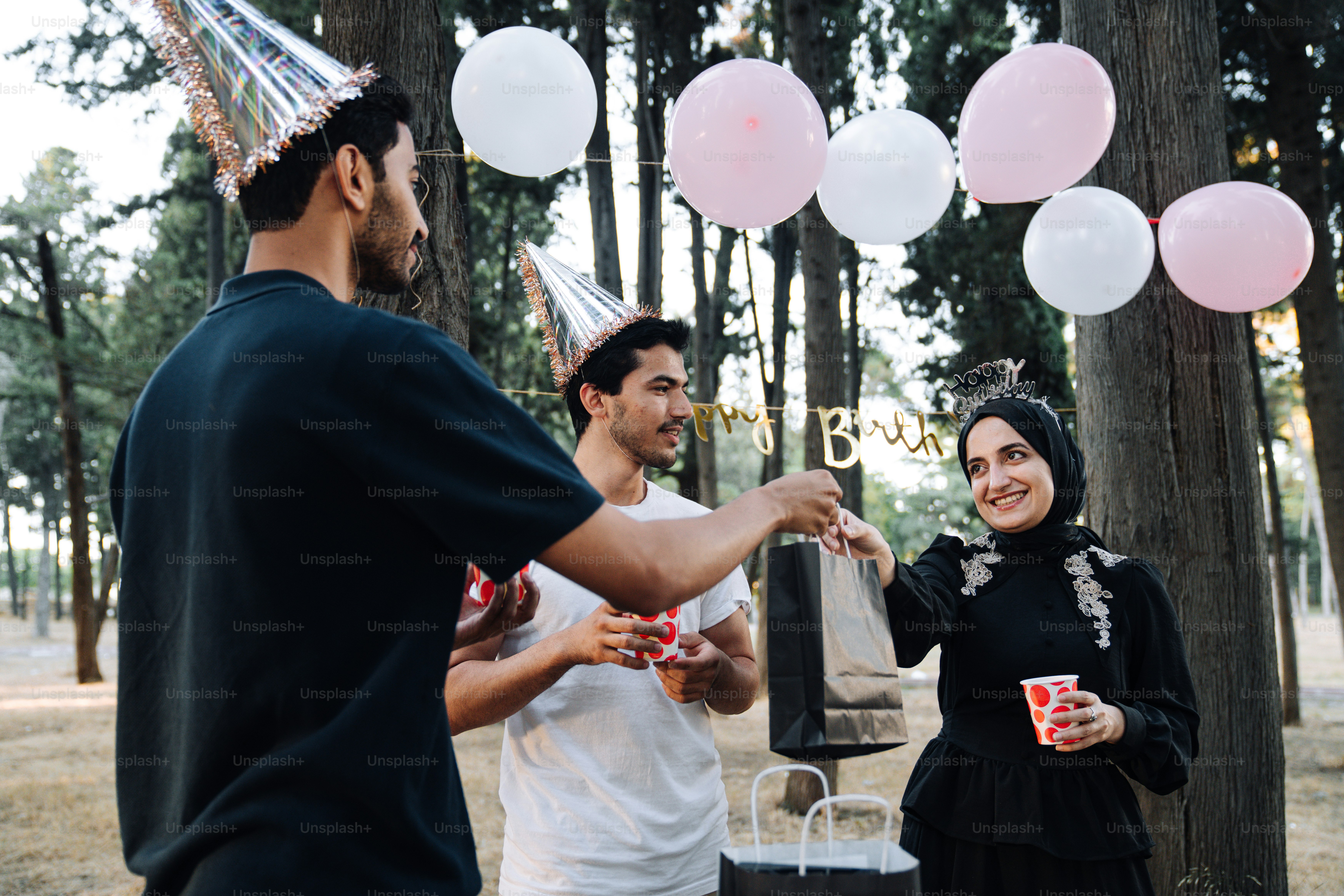 a group of people standing around each other