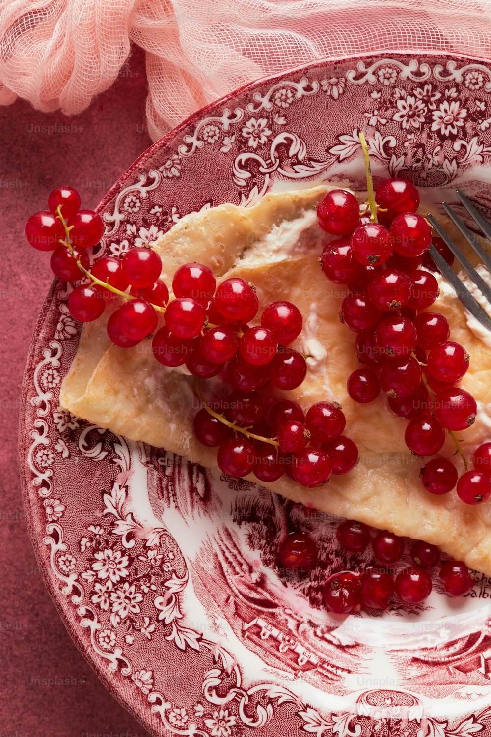 a plate with a piece of pie and a fork on it