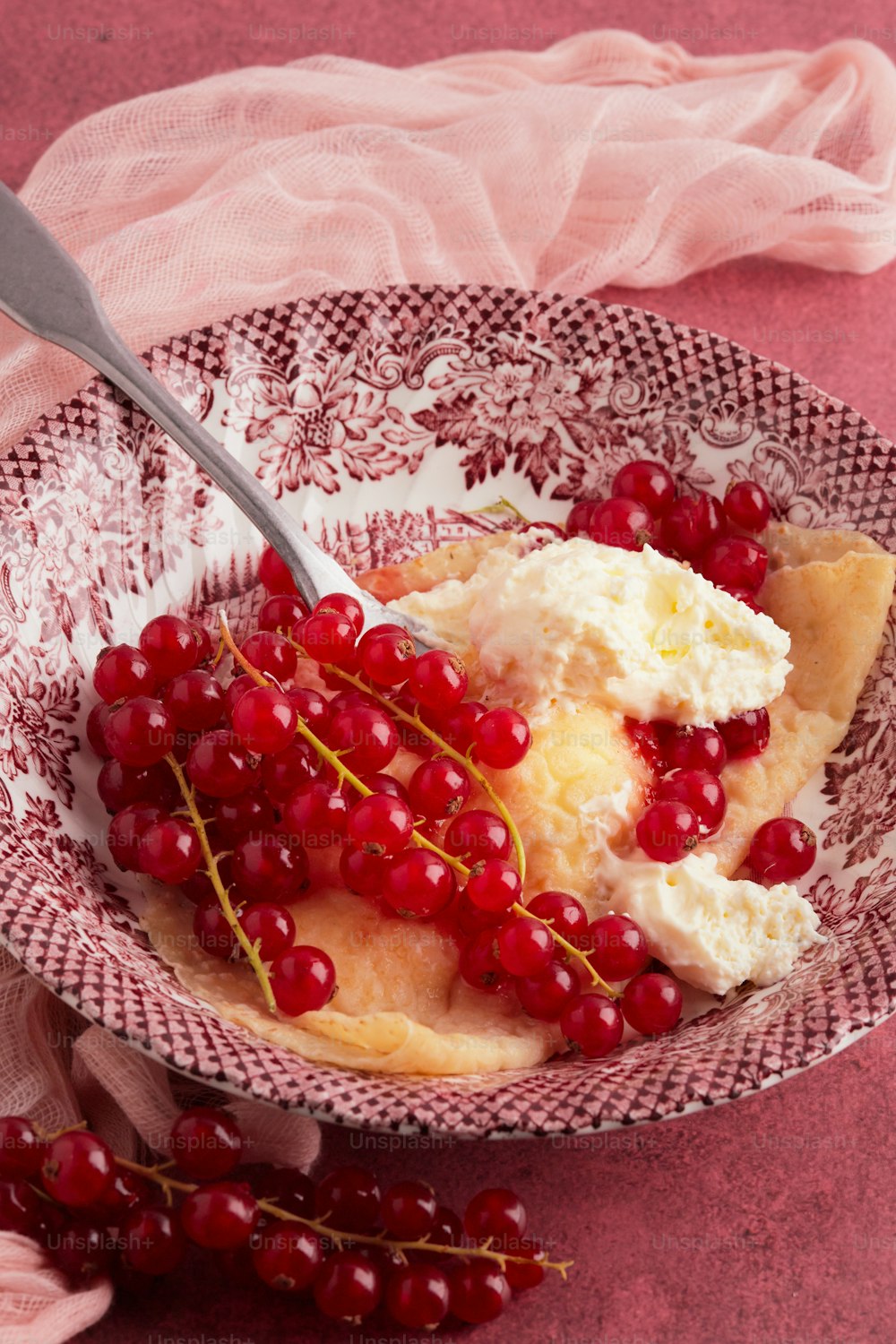 a bowl filled with ice cream and cherries